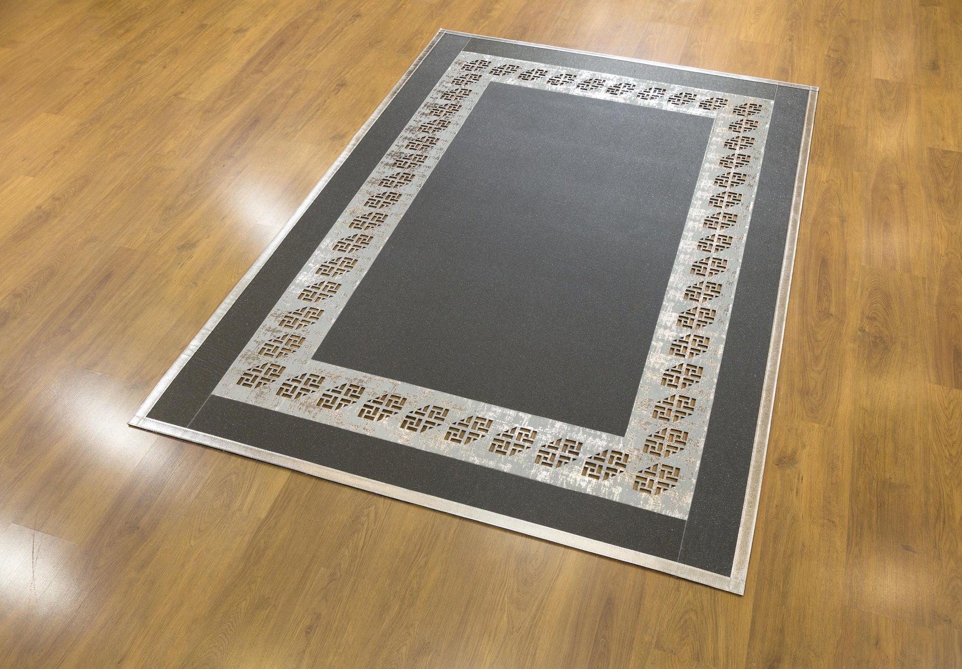 Black Faux Leather Rug: Laser Cut Silver Border, Modern Turkish Design (5x7 ft.)